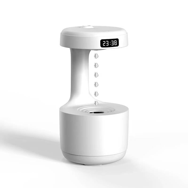 Small Belro humidifier on a wooden surface, showing a sleek white design with mist output and control buttons.