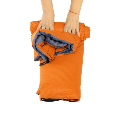 Belro adult sleeping bag laid out in a camping setting, showcasing its comfortable, insulated design for outdoor sleeping adventures.