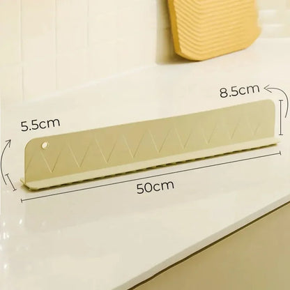 Belro silicone sink splash guard with suction cups, designed to protect countertops from water splashes in the kitchen.