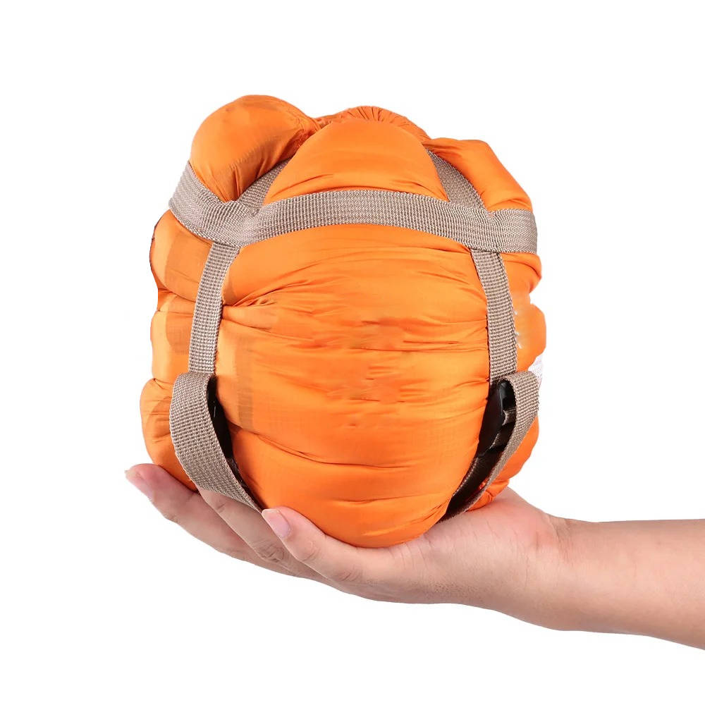 Belro sleeping bag for adults, shown folded with soft fabric and compact design, ideal for camping and outdoor adventures.