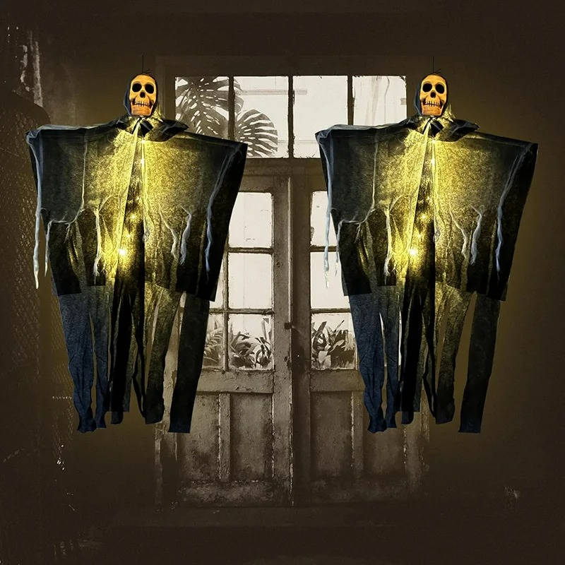 Set of two glowing skulls outdoor Halloween decorations by Belro, eerie skeletal heads with glowing eyes for spooky yard displays.