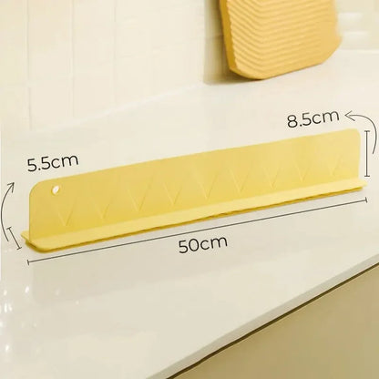 Belro silicone sink splash guard with suction cups, designed to protect countertops from water splashes in the kitchen.
