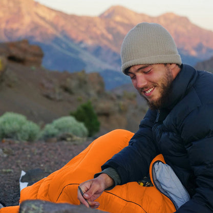 Adult sleeping bag by Belro, shown in a compact, insulated design suitable for outdoor camping and overnight stays.