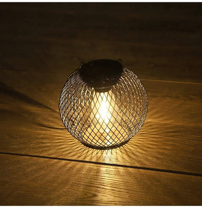 Belro outdoor solar hanging lantern hanging from an umbrella, providing ambient lighting for outdoor spaces.
