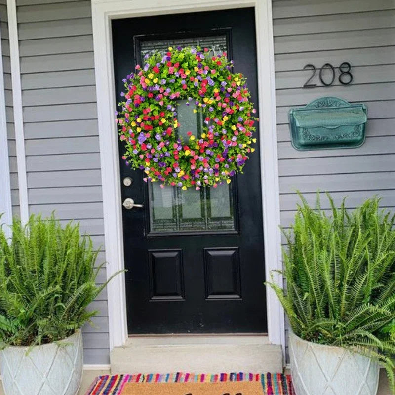 Colorful artificial wildflower spring wreath by Belro, decorated with vibrant faux flowers for home decor.