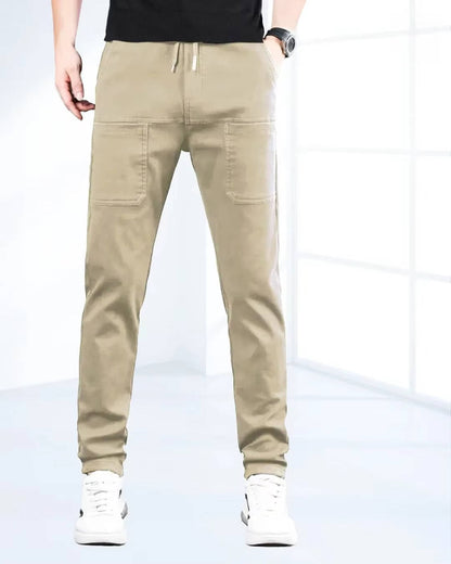 Men's high stretch cargo pants by Belro with multiple side and back pockets, shown in a relaxed fit on a model.