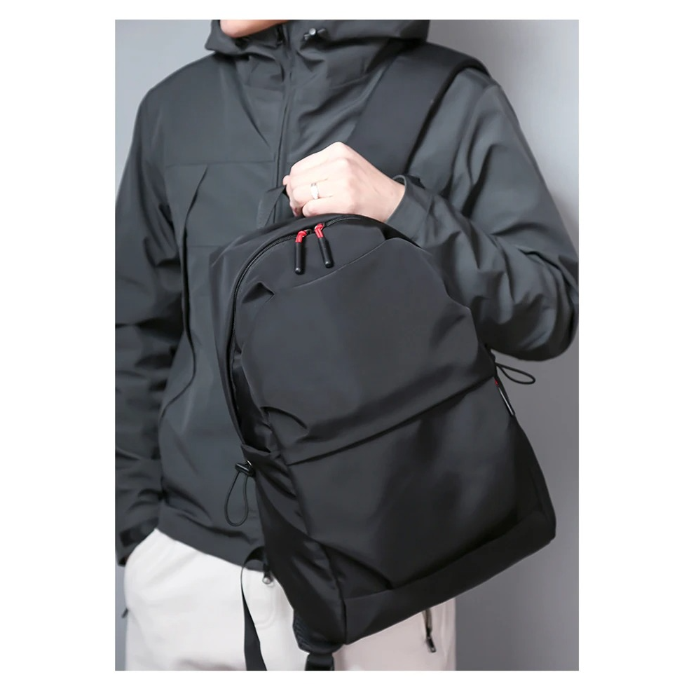 Belro minimalist black backpack designed for laptops, featuring sleek, modern style with multiple compartments for electronics.