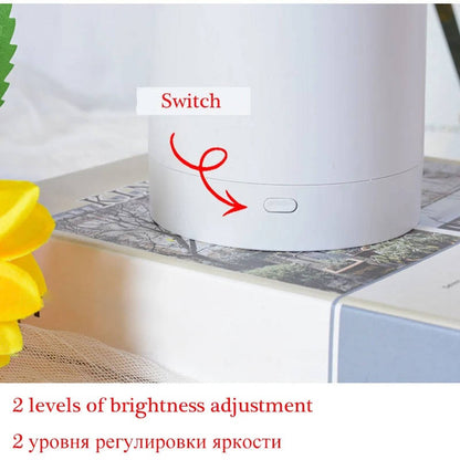 Belro sunflower-shaped night light emitting warm yellow glow, designed for cozy bedroom or living room lighting.