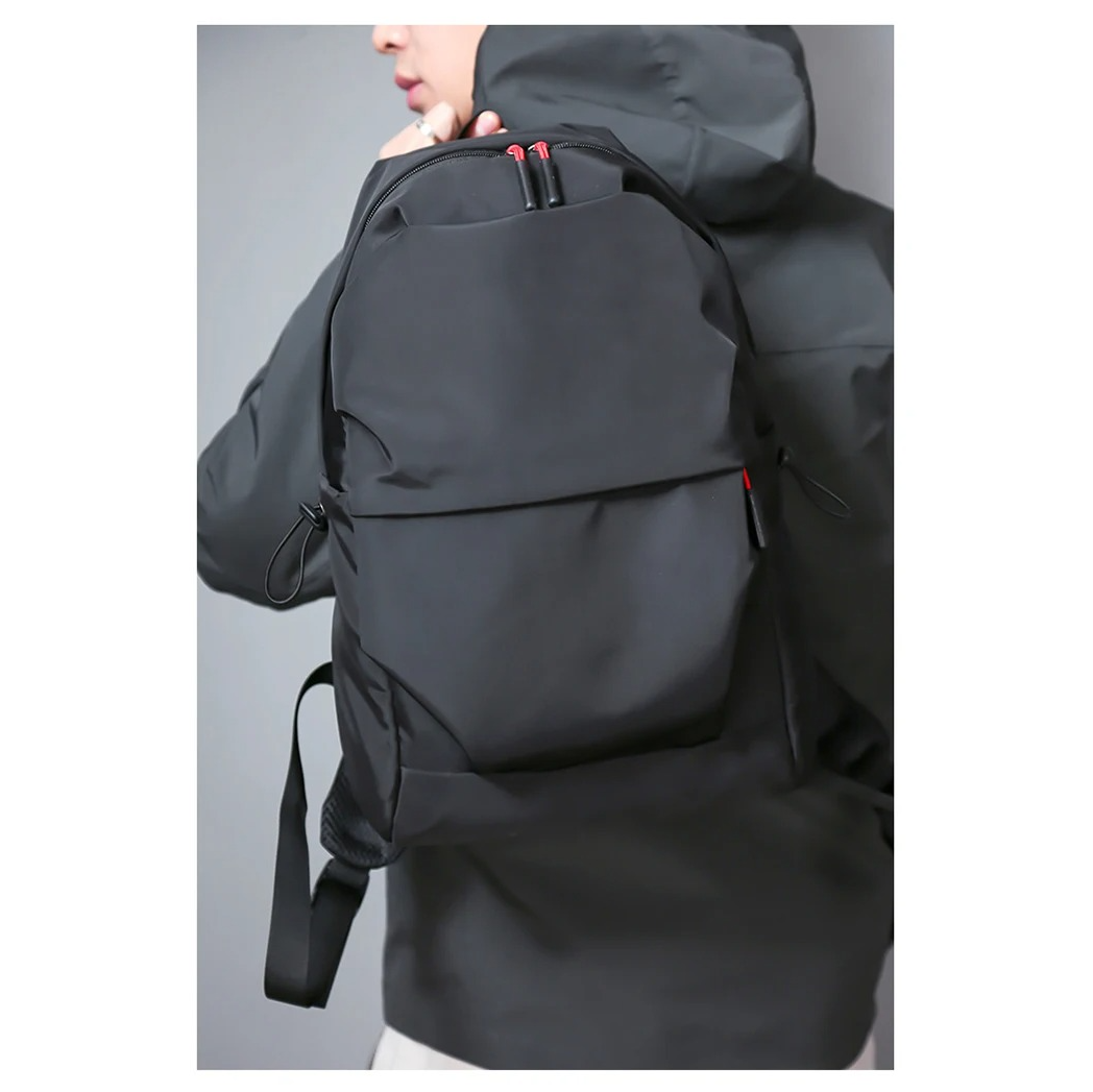 Black Belro minimalist backpack designed for laptops, with sleek, simple exterior and secure compartments for electronics.