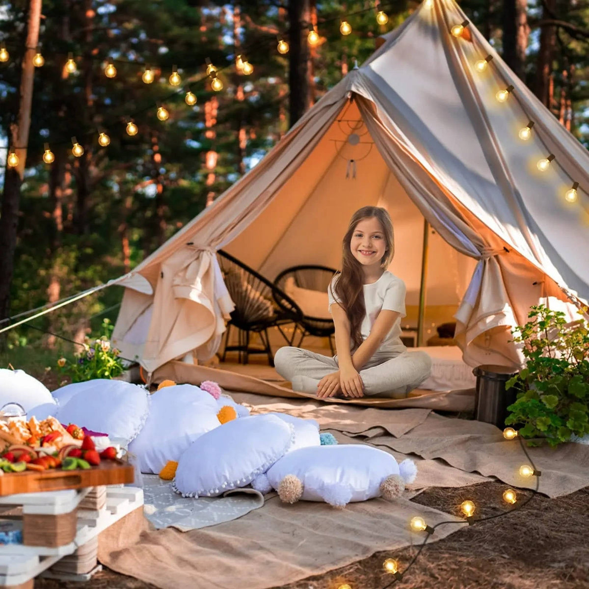 Belro LED outdoor string lights hanging in a garden for outdoor home and garden décor, with warm glowing bulbs.