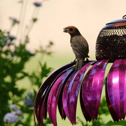 Belro outdoor flower bird feeder hanging from a garden branch, decorated with colorful flowers for attracting birds.