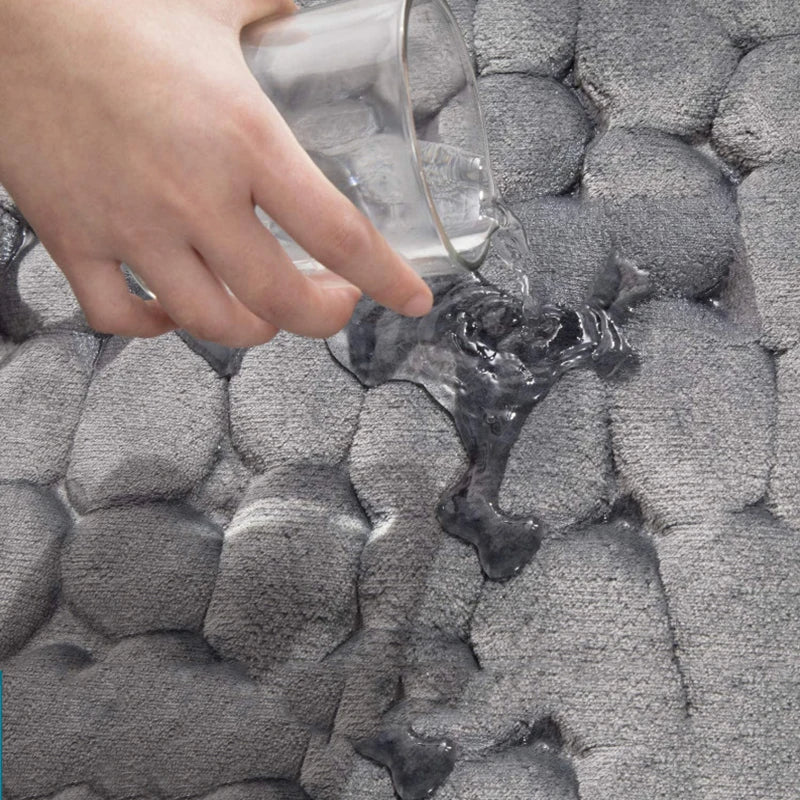 Belro Cobblestone Embossed Bathroom Mat with textured, stone-like pattern in neutral colors for home bathroom decor.