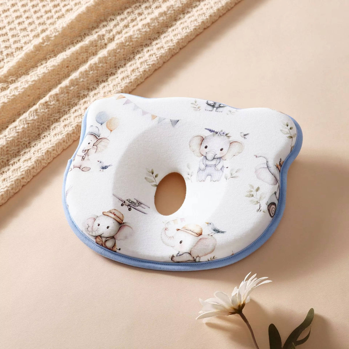 Belro infant pillow designed to prevent flat head, with sweat-absorbent fabric and ergonomic shape for comfortable baby support.