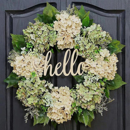 Green hydrangea wreath with a "Hello" sign, perfect for home decor, featuring lush flowers and welcoming design by Belro.