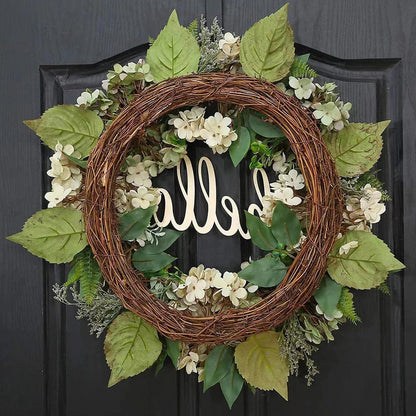 Green hydrangea wreath with a "Hello" sign, decorative home and garden decor by Belro, featuring lush foliage and stylish lettering.