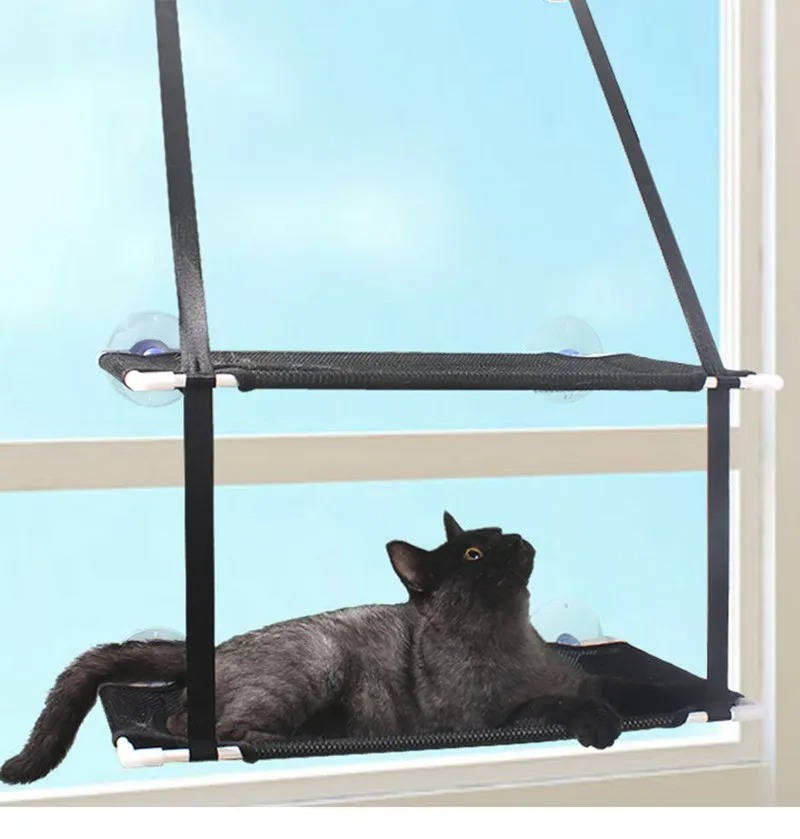 Belro cat window perch hammock attached to a window, providing a cozy resting spot for cats in a home and garden setting.