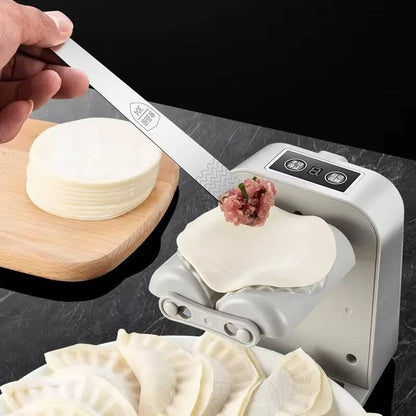 Belro automatic dumpling maker in a kitchen setting, showing the device with dumplings ready to cook on a clean countertop.