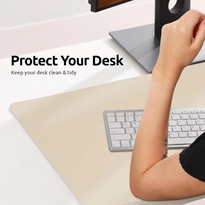 Belro leather desk mat for home office, featuring smooth brown leather surface and stitched edges on a wooden desk.
