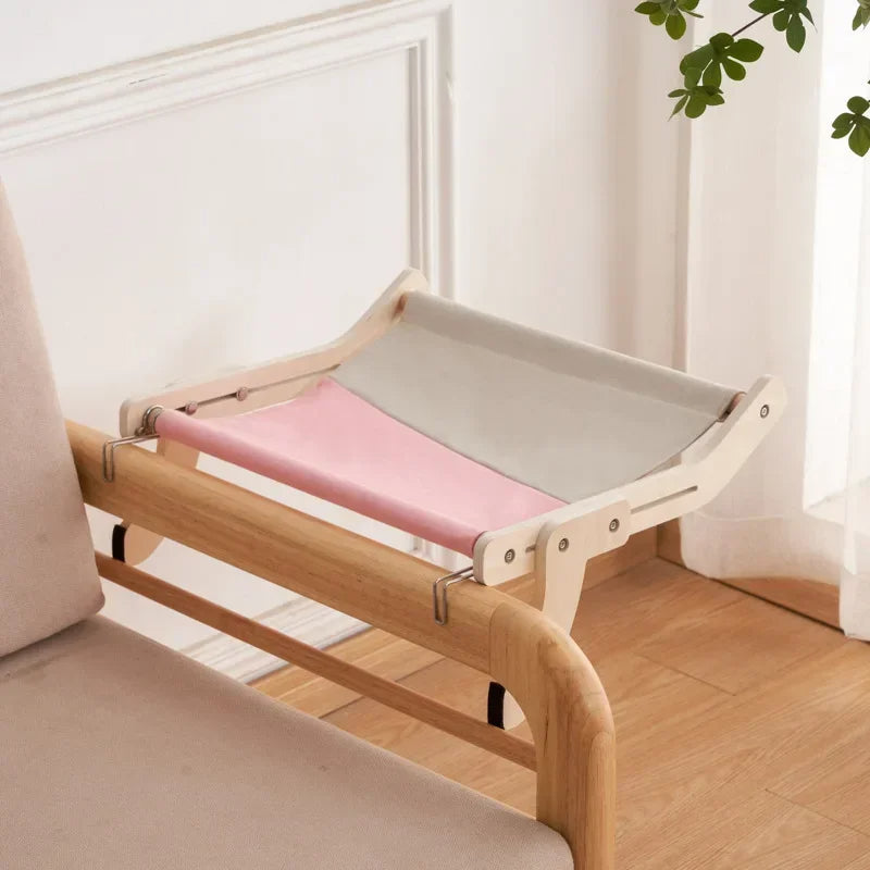 Belro wooden cat hammock bed hanging outdoors, cozy and sturdy for indoor or outdoor use in home and garden spaces.