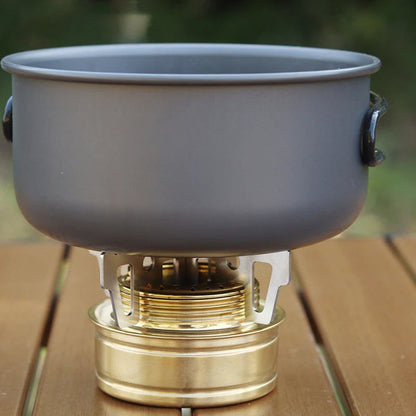 Belro Mini Portable Alloy Camping Stove set on a outdoor table, compact design for camping and outdoor cooking.
