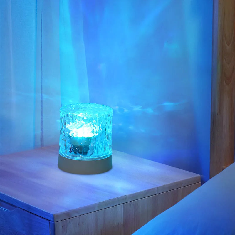 Belro Crystal Ripple Projector Night Light displaying swirling light patterns on a wall in a dark room.