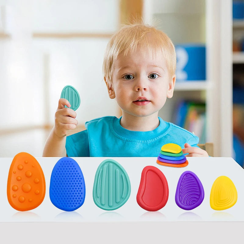 Six silicone sensory stone fidget toys in a pack from Belro, designed for stress relief and tactile stimulation.