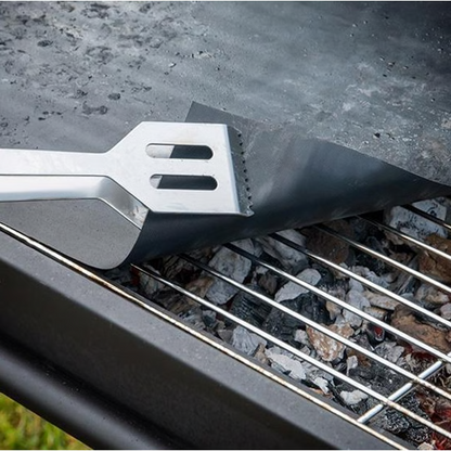 Belro chef non-stick BBQ grill mat laid out on a grill, perfect for preventing food sticking during outdoor cooking.