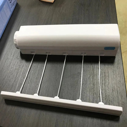 Belro retractable indoor laundry clothesline mounted on wall, ideal for drying clothes in home laundry room.