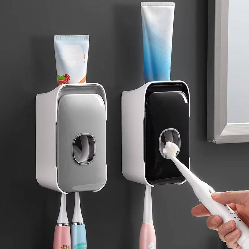 Belro automatic toothpaste dispenser mounted on bathroom wall, white plastic, ready for use in oral care routine.