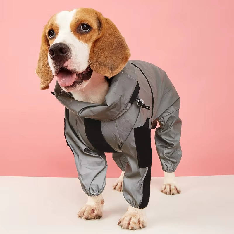 Belro waterproof dogs raincoat hanging outdoors, lightweight clothing for pets, with adjustable hood and reflective strips.