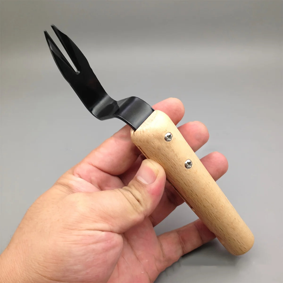Belro stainless steel weed puller tool with wooden handle, ideal for garden and outdoor weed removal.