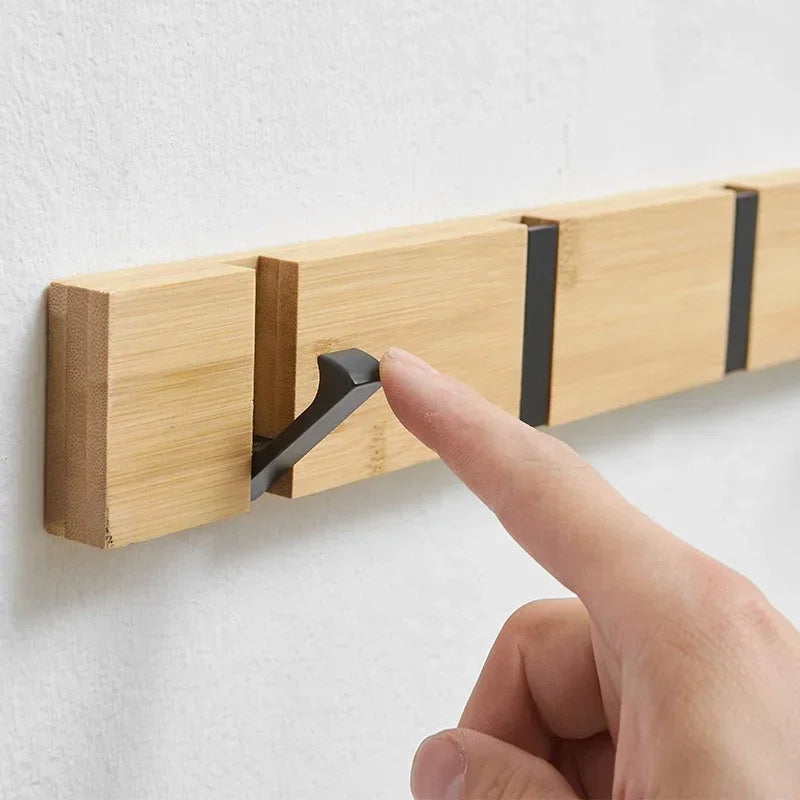 Wooden wall-mounted coat rack with hidden hooks, ideal for hanging jackets and coats in a stylish Belro design.