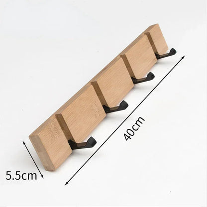 Wooden wall-mounted coat rack with hidden hooks by Belro, designed for hanging jackets and coats in an organized manner.