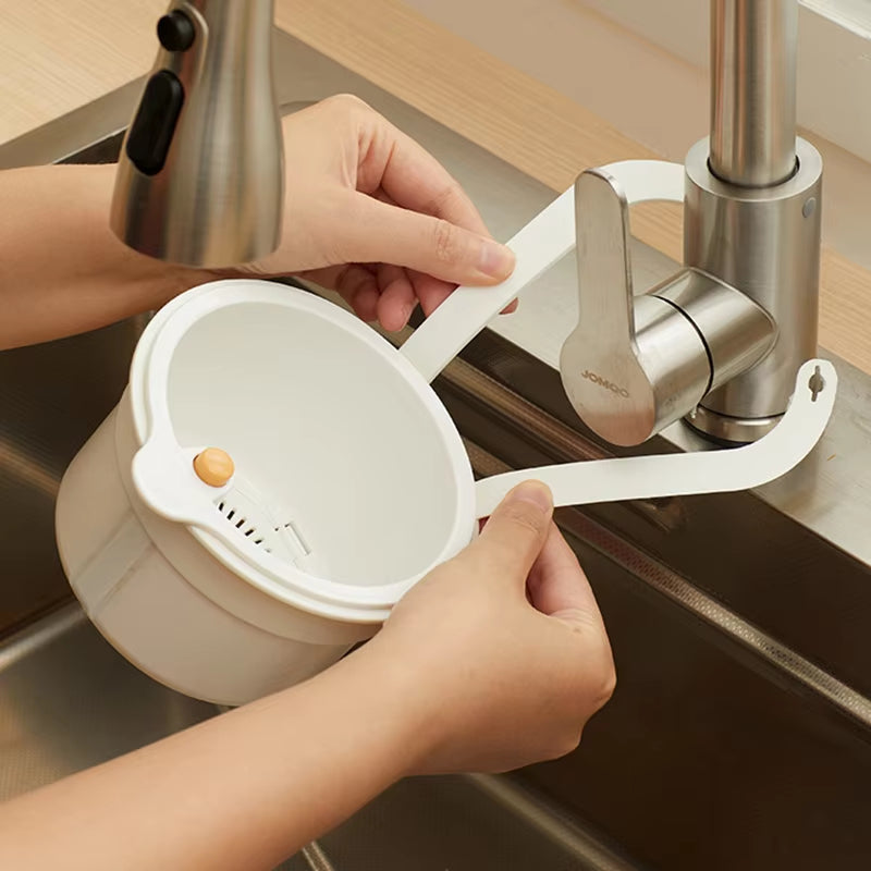 Mivoza hanging drain basket with two-part filter and one-click empty sink organizer for kitchen sink drainage.