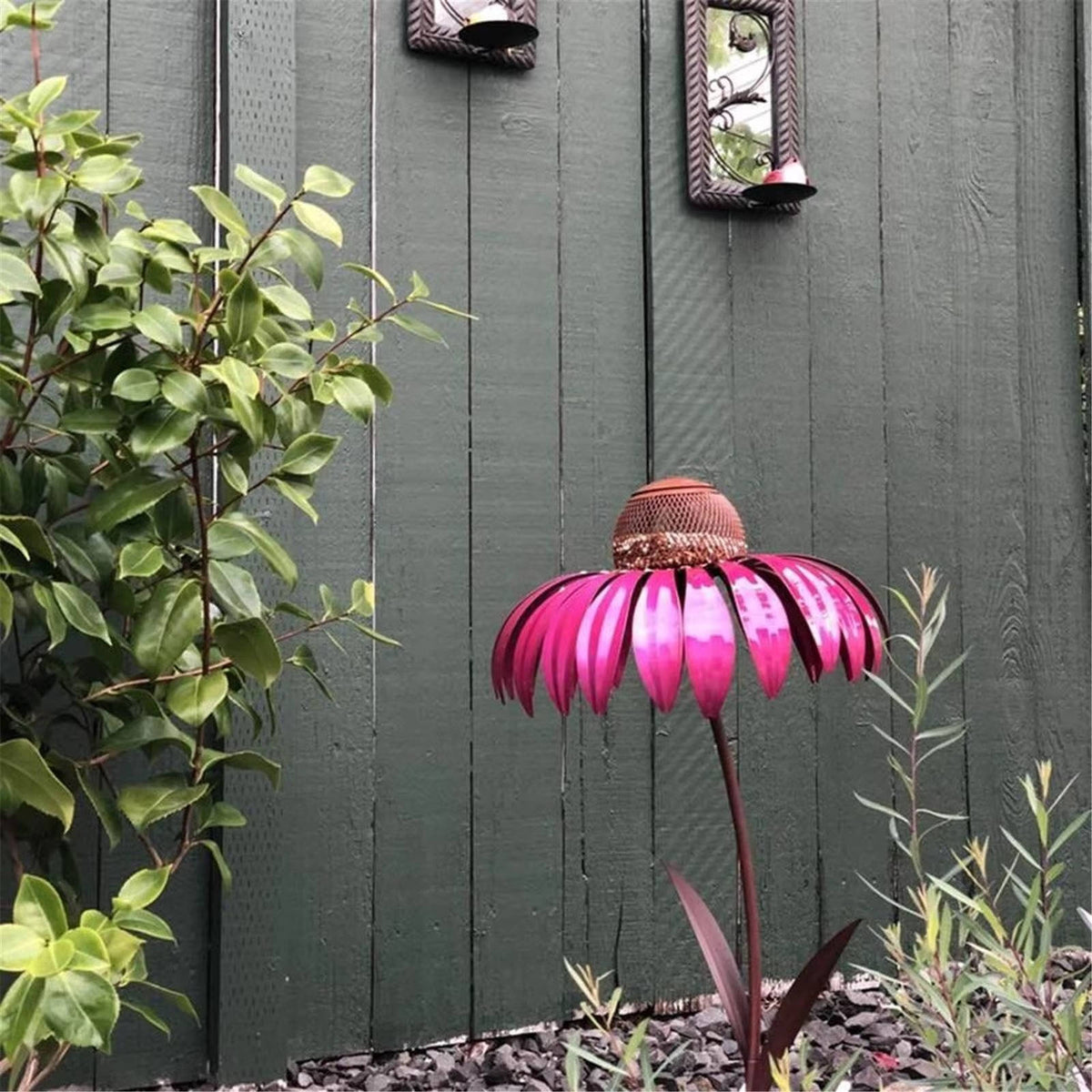 Belro outdoor flower bird feeder hanging from a garden branch with colorful flowers nearby.