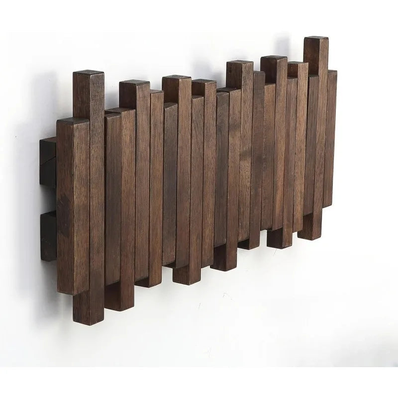 Natural wood Belro wall-mounted coat hook rack with flip-down coat holder, designed for hanging jackets and coats.