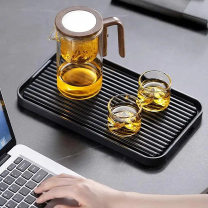 Clear glass teapot by Belro for water separation, featuring a traditional design and a built-in filter for brewing tea.