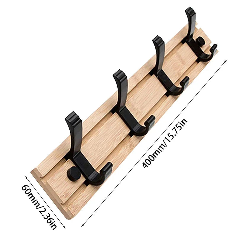 Wooden wall-mounted coat rack with sliding hooks, designed for hanging jackets and coats, by Belro.