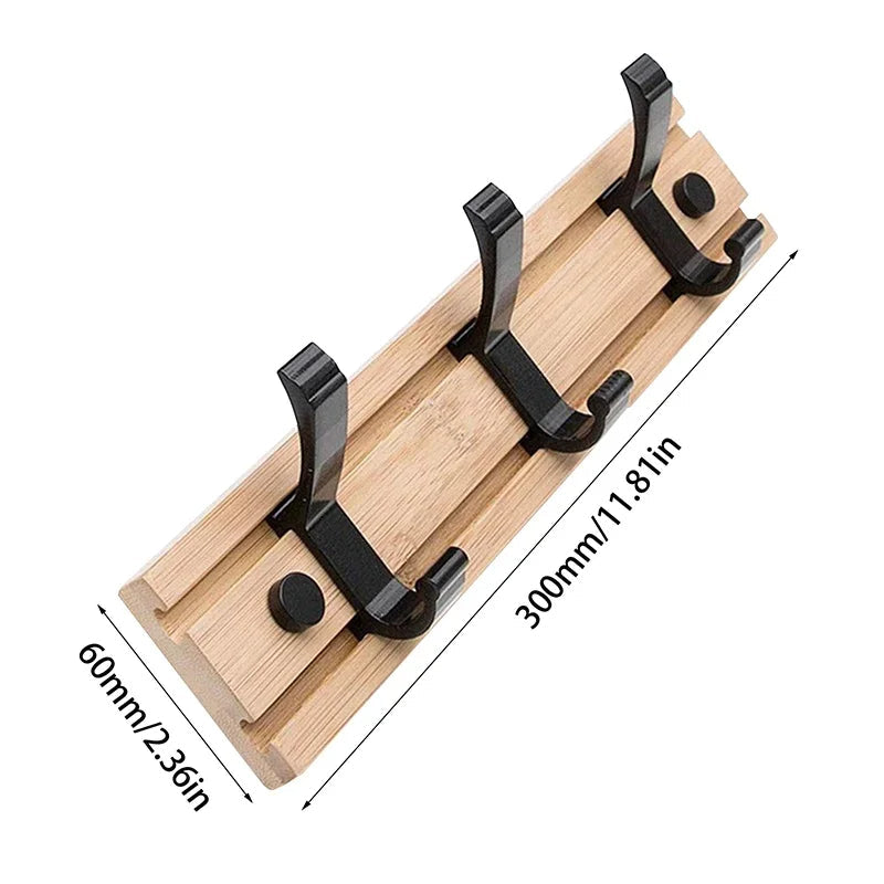Wooden wall-mounted coat rack with sliding hooks, ideal for hanging jackets and coats in a modern Belro design.