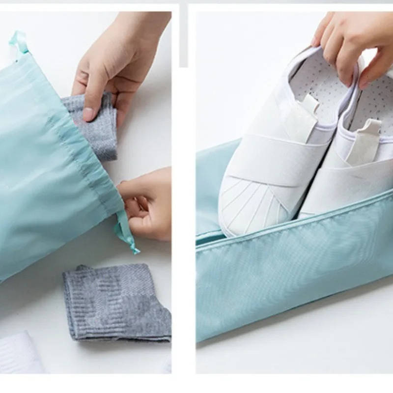 Set of seven Belro packing cubes for travel, organized in various sizes, inside a suitcase for efficient packing and luggage organization.