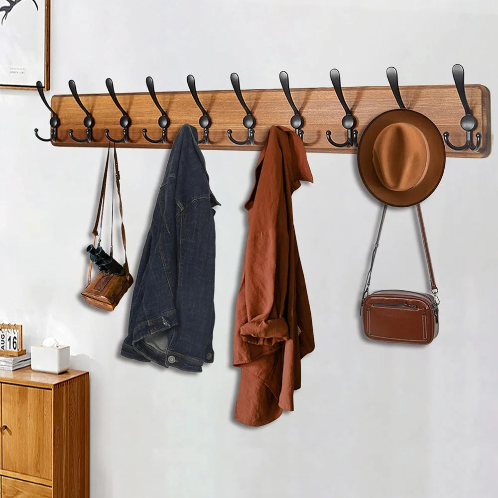 Wooden wall-mounted coat rack by Belro with 10 hooks, ideal for hanging jackets and coats in an entryway or hallway.