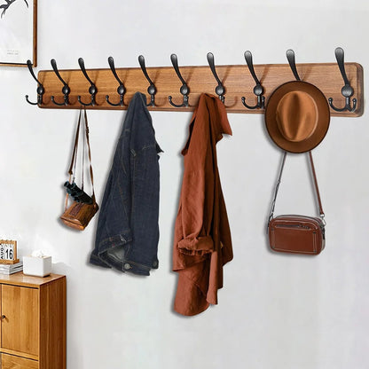 Wooden wall-mounted coat rack by Belro with 10 hooks, ideal for hanging jackets and coats in an entryway or hallway.