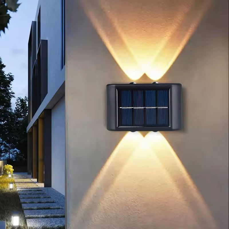 Belro energy-efficient LED solar outdoor wall light mounted on exterior wall, illuminating garden or patio area.