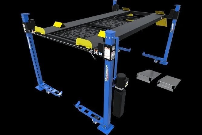 Casavibeo Dannmar D4-9 four-post lift with 9,000-lb capacity, showing the sturdy steel frame and lifting arms in a garage setting.