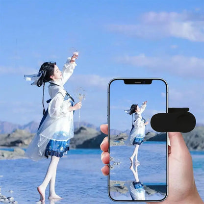 Mivoza camera mirror reflector clip attached to a smartphone lens, showcasing a creative kaleidoscope effect for photography accessories.