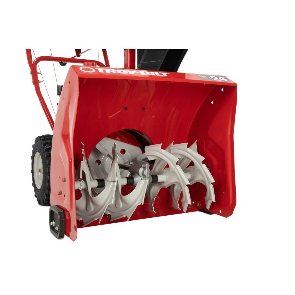 Troy-Bilt Storm 24-inch two-stage gas snow blower with large auger and handles, ready for winter snow removal.