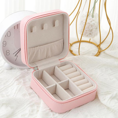 Belro travel jewelry case with multiple compartments for organizing necklaces, rings, and earrings securely.