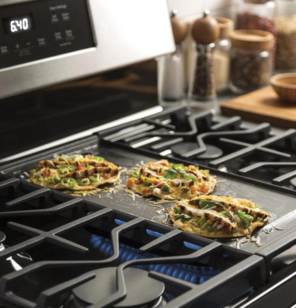 Casavibeo GE 30-inch freestanding gas range with four burners and oven, stainless steel finish, and control knobs on the front.