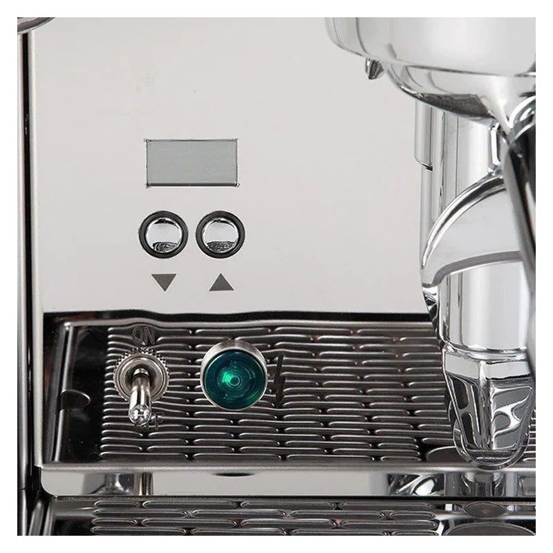 Casavibeo ECM Mechanika Max rotary espresso machine with stainless steel exterior and portafilter in use.