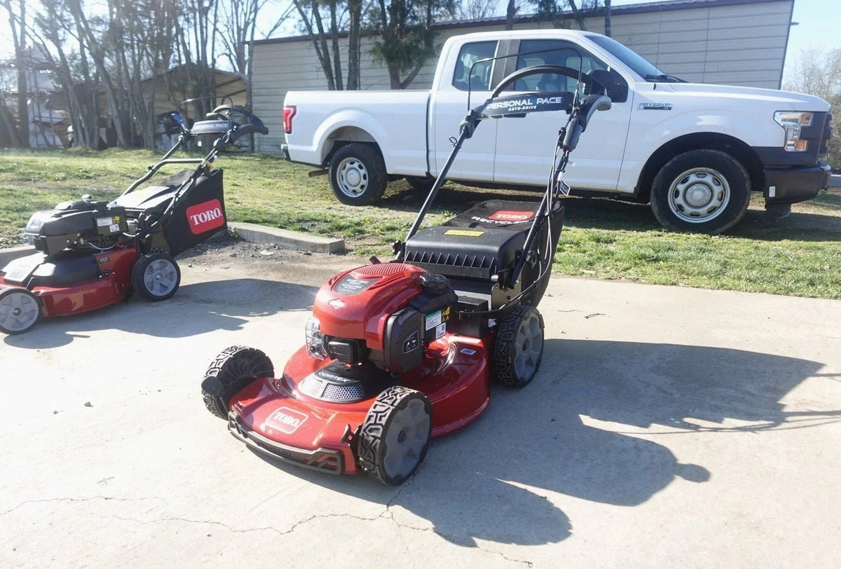 Casavibeo Toro 22-inch Recycler SmartStow electric lawn mower with grass collection bag and adjustable handle on a lawn.